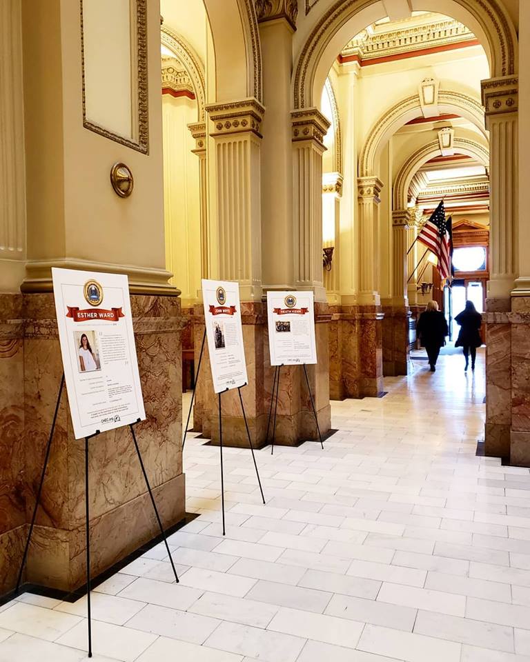 Homeschool graduate posters displayed in the Capitol