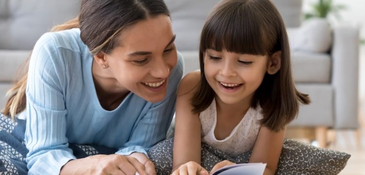Homeschool mother reading to daughter