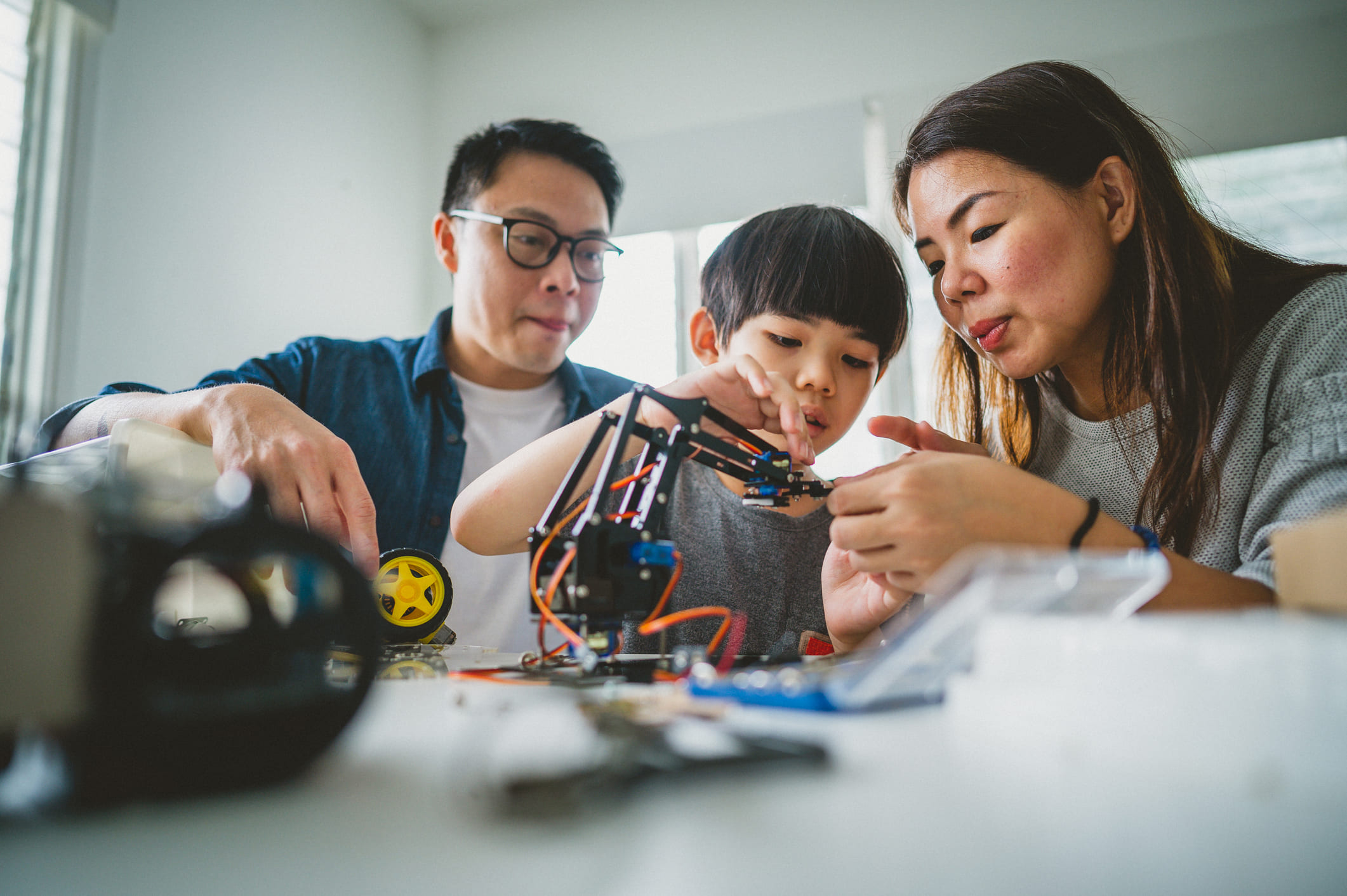 family working on robotics