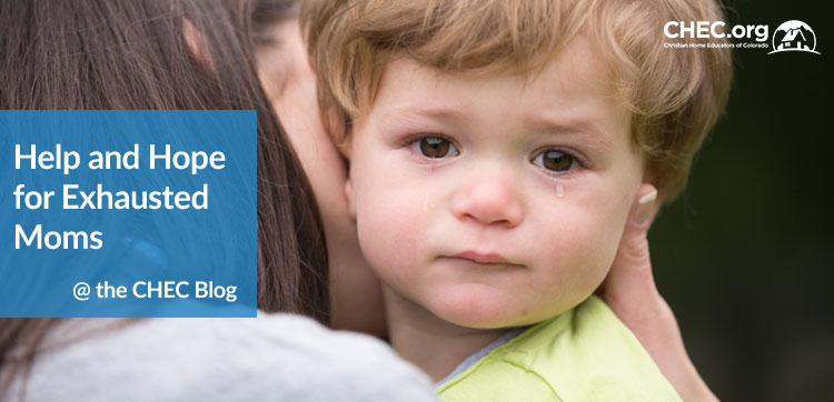 Tired mom comforting child