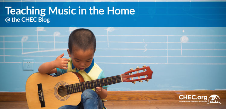 Teaching-Music-in-the-Home Toddler playing guitar